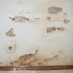 Damaged finish at the base of a wall